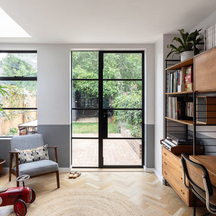 Photo of a medium sized retro home office in Oxfordshire with light hardwood flooring.