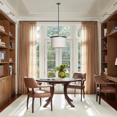 Transitional built-in desk dark wood floor and brown floor home office photo in Chicago