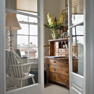 Inspiration for a timeless freestanding desk carpeted home office remodel in Cardiff with white walls