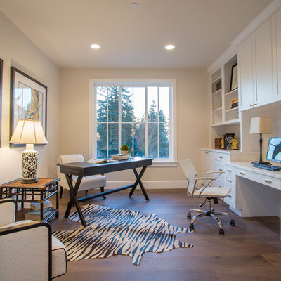 Country built-in desk dark wood floor study room photo in Seattle with beige walls