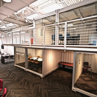 Example of an urban home office design in Las Vegas with white walls