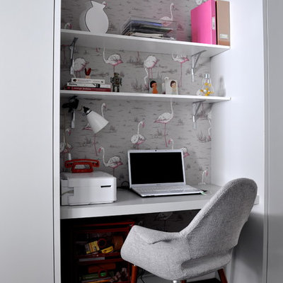 Example of a small trendy built-in desk home office design in London