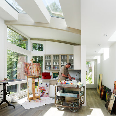 Inspiration for a contemporary medium tone wood floor home studio remodel in San Francisco with white walls