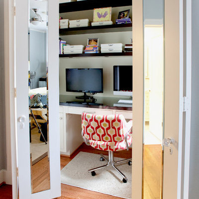 Example of a trendy built-in desk home office design in Dallas
