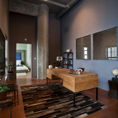 Example of a large trendy freestanding desk medium tone wood floor home office design in Baltimore with blue walls
