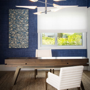 Example of a trendy freestanding desk study room design in New York with blue walls
