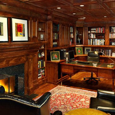 Example of a classic freestanding desk dark wood floor home office design in Denver