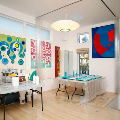 Trendy light wood floor home studio photo in Los Angeles with white walls