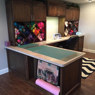 Inspiration for a large contemporary built-in desk dark wood floor craft room remodel in San Diego with beige walls and no fireplace