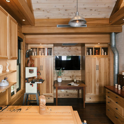 Example of a small country freestanding desk dark wood floor and brown floor home studio design in Atlanta with no fireplace and white walls