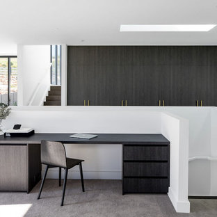 Design ideas for a small contemporary study room in Sydney with white walls, carpet and a built-in desk.