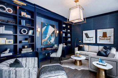 Study room - transitional built-in desk dark wood floor study room idea in Other with blue walls and no fireplace