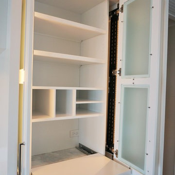 Custom pull out printer shelf with pocket doors for easy acces