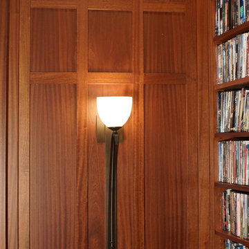 Detailed wood paneling  and wall sconce