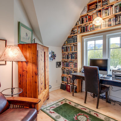 Inspiration for a farmhouse freestanding desk light wood floor study room remodel in Seattle with white walls and no fireplace