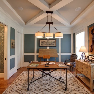 Example of an eclectic freestanding desk dark wood floor study room design in Charlotte with blue walls