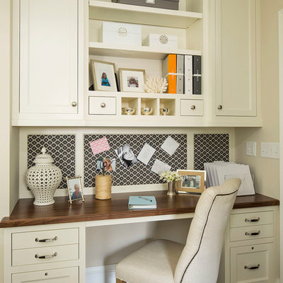 Study room - traditional built-in desk dark wood floor study room idea in Minneapolis with beige walls
