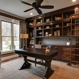 Inspiration for a mid-sized rustic freestanding desk light wood floor and beige floor study room remodel in Other with brown walls and no fireplace