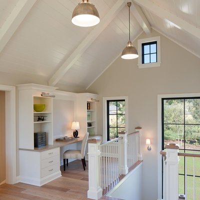 Mid-sized transitional built-in desk light wood floor and brown floor home office photo in Grand Rapids with beige walls and no fireplace