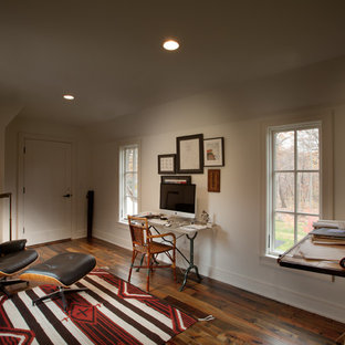 Home studio - traditional freestanding desk dark wood floor home studio idea in Minneapolis with white walls