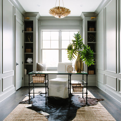 Example of a mid-sized transitional freestanding desk dark wood floor study room design in Chicago with gray walls