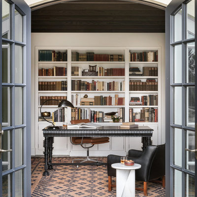 Study room - mediterranean freestanding desk study room idea in Portland with white walls