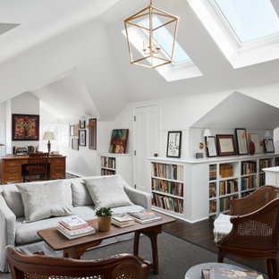 Cette photo montre un grand bureau chic avec un mur blanc, un sol en bois foncé, un bureau indépendant, un sol marron, un plafond voûté et une cheminée standard.