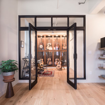 Home studio - industrial light wood floor home studio idea in Other with white walls