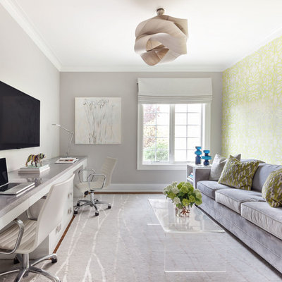 Transitional built-in desk study room photo in New York with gray walls and no fireplace