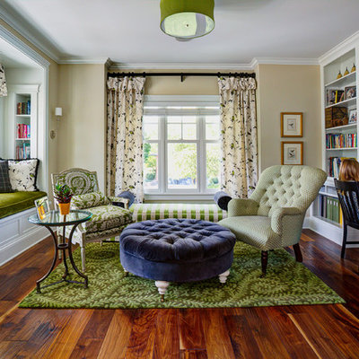 Elegant built-in desk dark wood floor home office photo in Minneapolis with beige walls