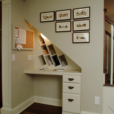 Small elegant built-in desk dark wood floor and brown floor study room photo in Other with beige walls