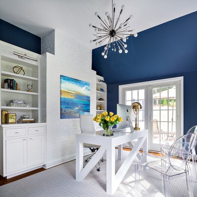 Study room - transitional freestanding desk study room idea in New York with blue walls