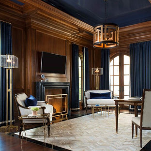 Study room - mediterranean freestanding desk dark wood floor and brown floor study room idea in Dallas with brown walls and a standard fireplace