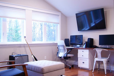 Photo of a large traditional study in Ottawa with grey walls, medium hardwood flooring, no fireplace and a built-in desk.
