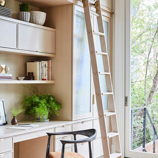 Inspiration for a transitional built-in desk light wood floor and beige floor study room remodel in New York