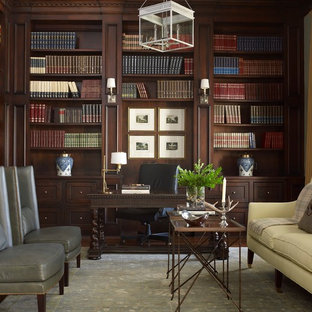 Example of a mid-sized classic freestanding desk dark wood floor study room design in Houston