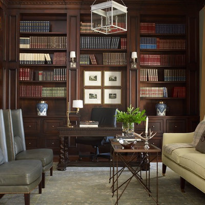 Example of a mid-sized classic freestanding desk dark wood floor study room design in Houston