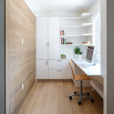 Study room - mid-sized modern built-in desk light wood floor and beige floor study room idea in Ottawa with white walls