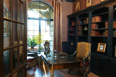 Example of a tuscan home office design in Raleigh