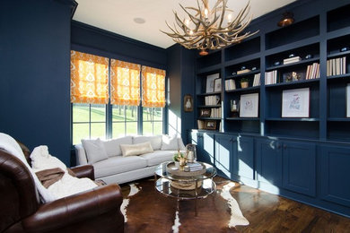 Inspiration for a mid-sized transitional dark wood floor and brown floor study room remodel in Atlanta with blue walls and no fireplace