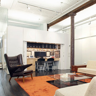 Example of a minimalist built-in desk home office design in New York
