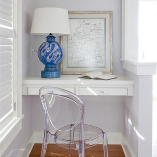 Photo of a small classic home office in Other with purple walls, medium hardwood flooring and a built-in desk.