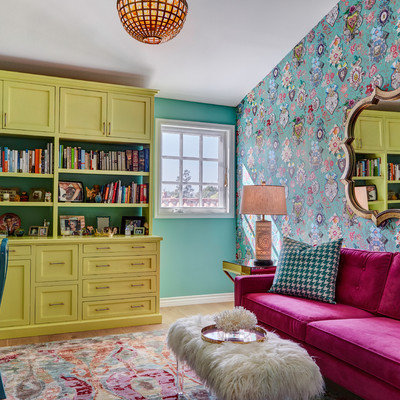 Home office library - eclectic freestanding desk home office library idea in Los Angeles with multicolored walls