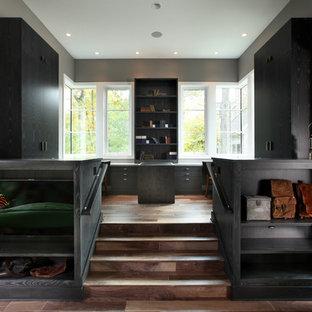 Inspiration for a large contemporary built-in desk medium tone wood floor home office remodel in Grand Rapids with gray walls