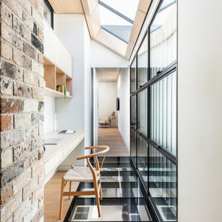Design ideas for a contemporary home office in Sydney with white walls and a built-in desk.