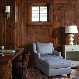 Example of a small beach style freestanding desk dark wood floor and brown floor study room design in Grand Rapids with brown walls