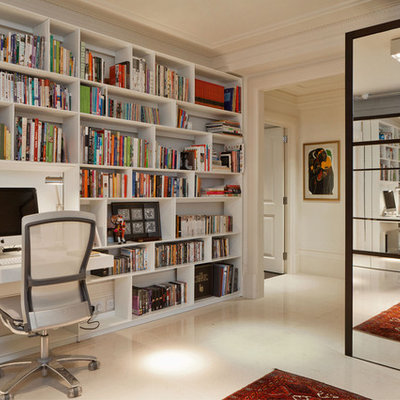 Inspiration for a contemporary built-in desk beige floor study room remodel in London with white walls