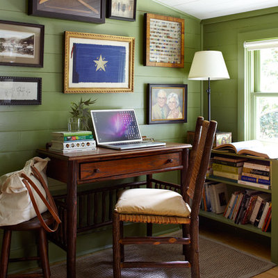 Inspiration for a country freestanding desk light wood floor home office remodel in Austin with green walls