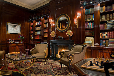 ニューヨークにある巨大なトラディショナルスタイルのおしゃれな書斎 (茶色い壁、カーペット敷き、標準型暖炉) の写真