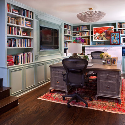 Inspiration for a mid-sized transitional freestanding desk dark wood floor study room remodel in Los Angeles with blue walls and no fireplace